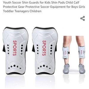 2 pair of shin guards black and white size small and medium New